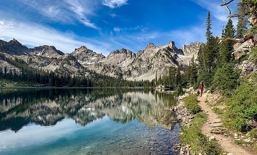 A hiker along Alice Lake in the Sawtooth Mountain Wilderness near Sun Valley, Idaho.