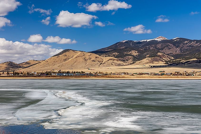 Eagle Nest, New Mexico in spring, with the high-country town and lake below the Sangre de Cristo peaks. (Credit: kwan tse via Shutterstock)
