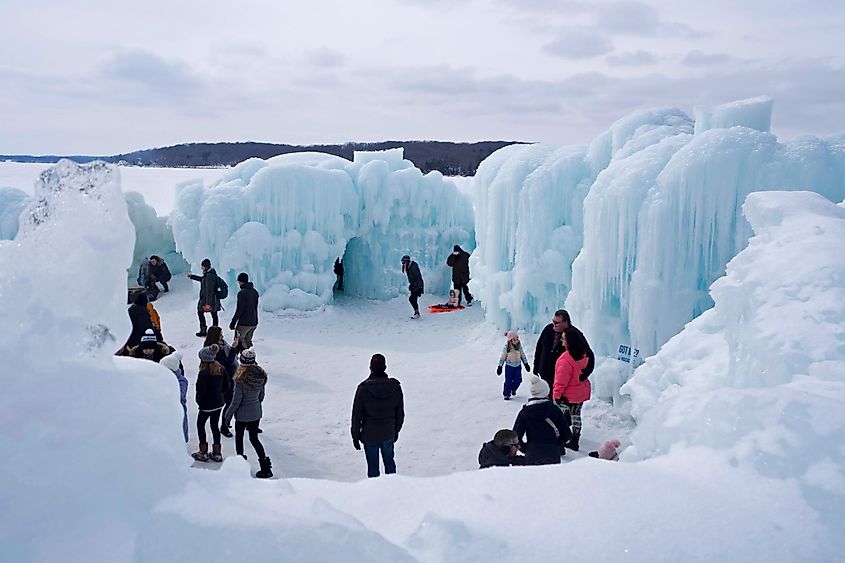 People enjoying the annual icy winter playland attraction at Lake Geneva, Wisconsin.
