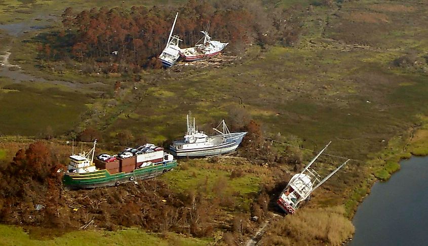 Hurricane Katrina damage in Bayou La Batre, Alabama, with the cargo ship M/V Caribbean Clipper and four fishing boats pushed ashore near the bayou