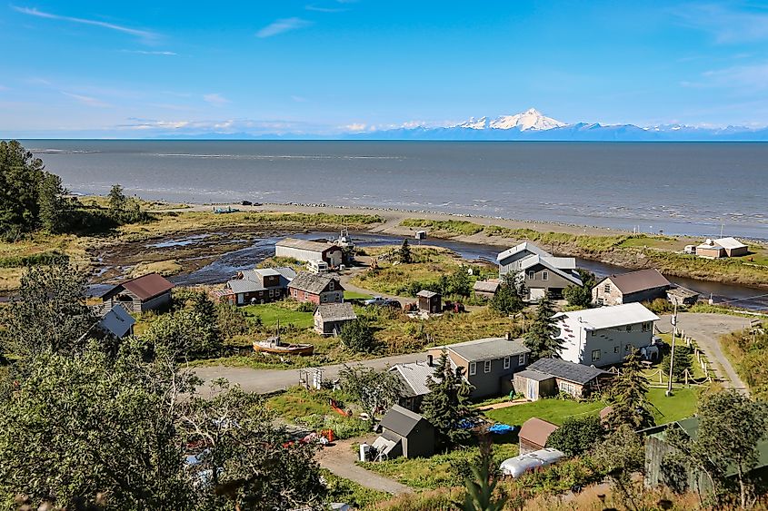 Aerial view of Ninilchik a small Alaskan Native village with Cook Inlet and Aleutian volcanoes , Alaska