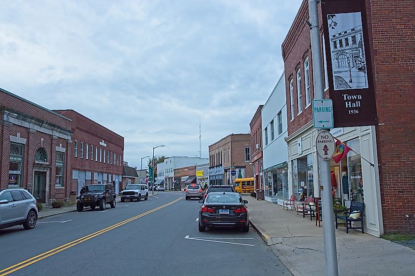 Early evening street scene down Market street lined with red brick buildings in Onancock, Virginia
