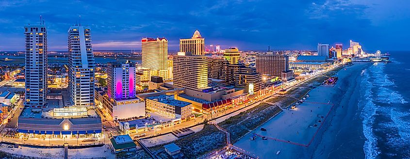 Aerial panorama of Atlantic city along the boardwalk at dusk.