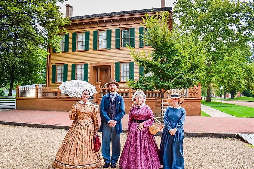  Period actors and actresses standing in front of Abraham Lincoln Home National Historic Site in Springfield, Illinois.