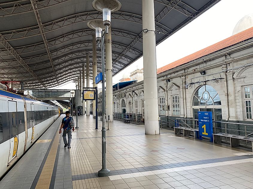 Walking alongside a train and colonial station in Ipoh, Malaysia.