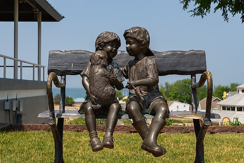 Sculpture of children on bench in downtown St. Joseph, Michigan