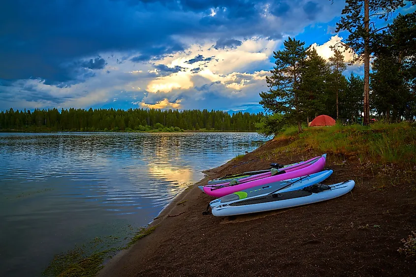 Storm clouds along Hebgen Lake with paddleboard and kayaks