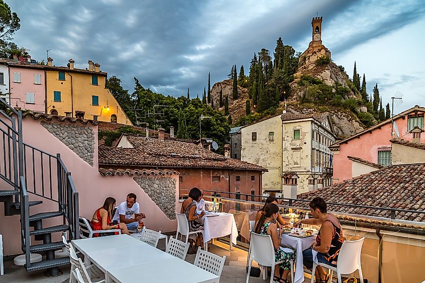 People enjoying dinner with friends at Brisighella, Italy