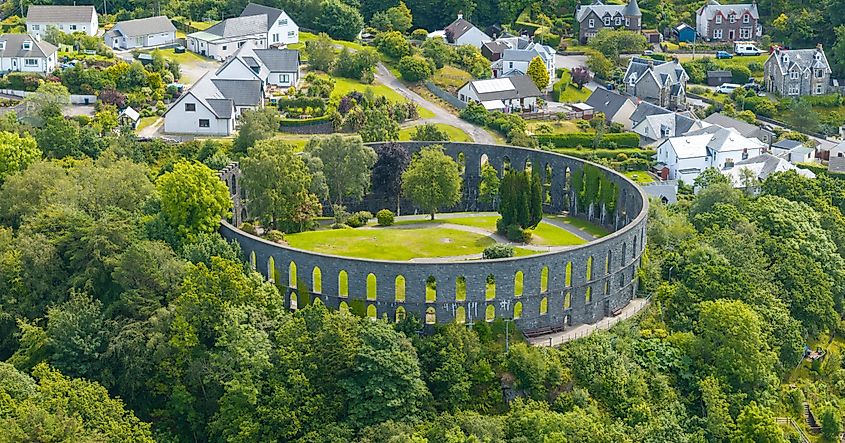Aerial view of McCaig’s Tower overlooking Oban Bay and the Isle of Mull, Scotland.