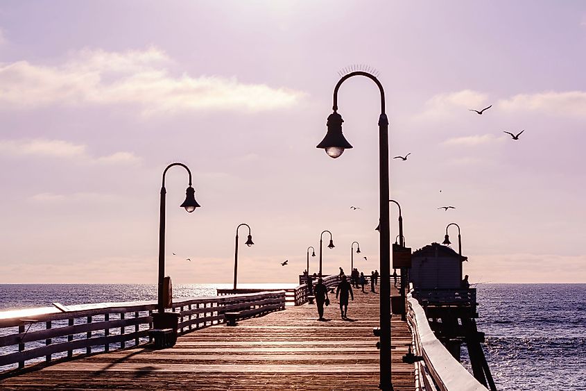 People walking on a pier in San Clemente, California