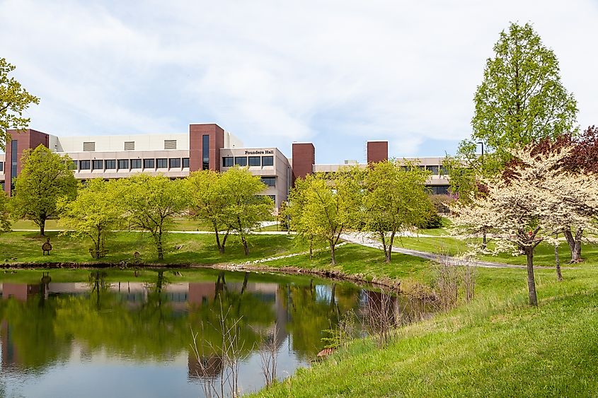 Founders and Alumni Hall overlooking a pond on the Edwardsville campus of Southern Illinois University.