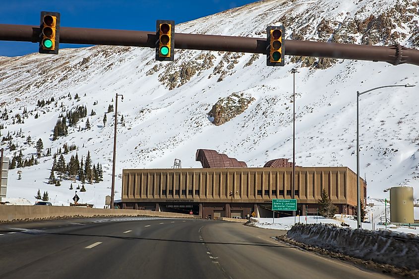 View of the wet side of road tunnel in the Rocky Mountains of Colorado. Snow covered mountainside with tunnel opening for the Eisenhower-Johnson Tunnel, Colorado Editorial credit: Rexjaymes / Shutterstock.com