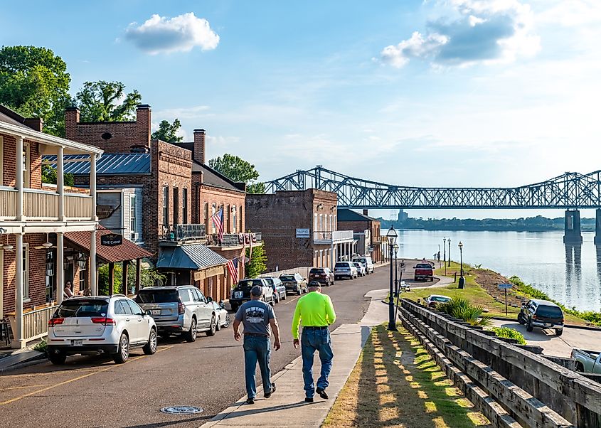 Two men walking towards water front in Natchez, Mississippi