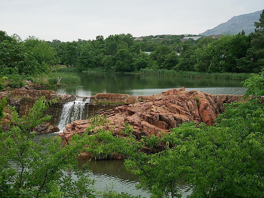 Wide shot of the scenic bath lake with waterfalls at Medicine Park, Oklahoma.