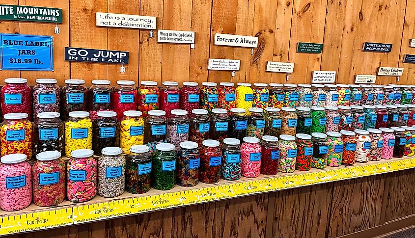 Colorful candy jars on the shelf of the world's longest candy counter in Littleton, New Hampshire