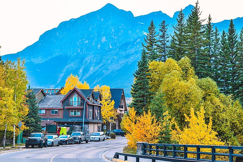 A street in Canmore, Alberta in front of the Rocky Mountains.