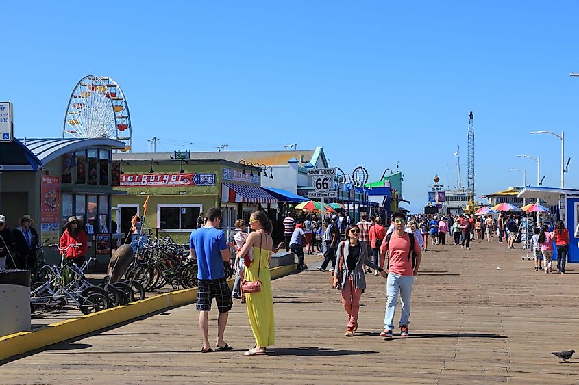 People visit the pier in Santa Monica, California