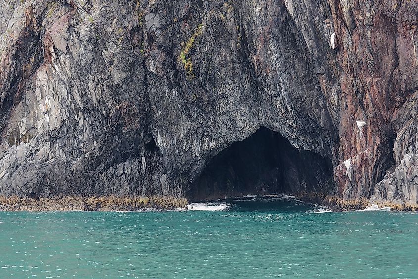 Sea cave on the rocky coast of Kenai Fjords National Park, Alaska. 