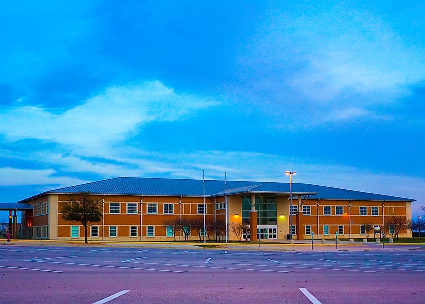 Rouse High School at sunset in Leander, Texas, with a colorful sky over the growing Hill Country town just outside Austin