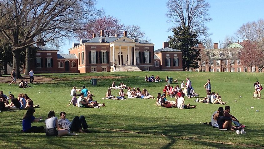 "The Beach" area of the Johns Hopkins University Homewood campus, with students in foreground and Homewood House in back.