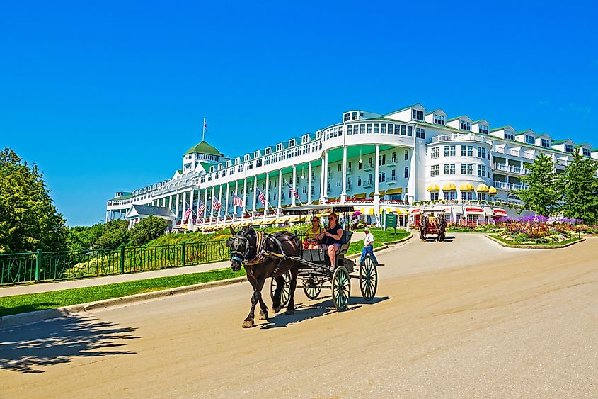 The Grand Hotel on Mackinac Island Michigan showing horse and buggy ride located on Lake Huron, Michigan.