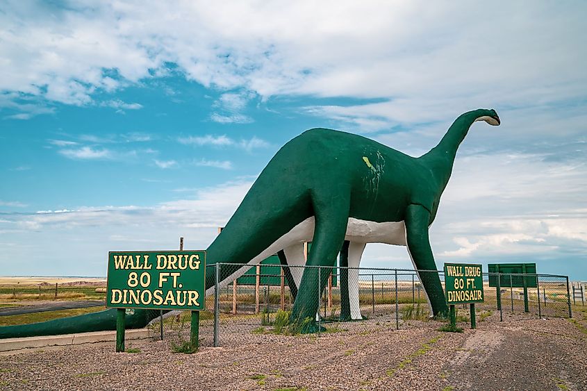 A large 80ft dinosaur at the entrance of the town of Wall and its famous Wall Drug drugstore