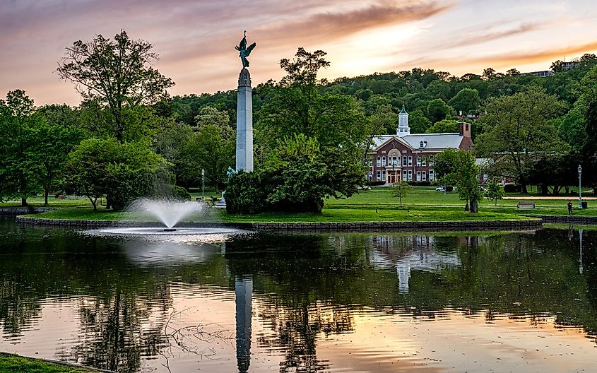 Sunset view of Soldiers and Sailors Memorial in Edgemont Park featuring the tall granite obelisk Winged Victory.