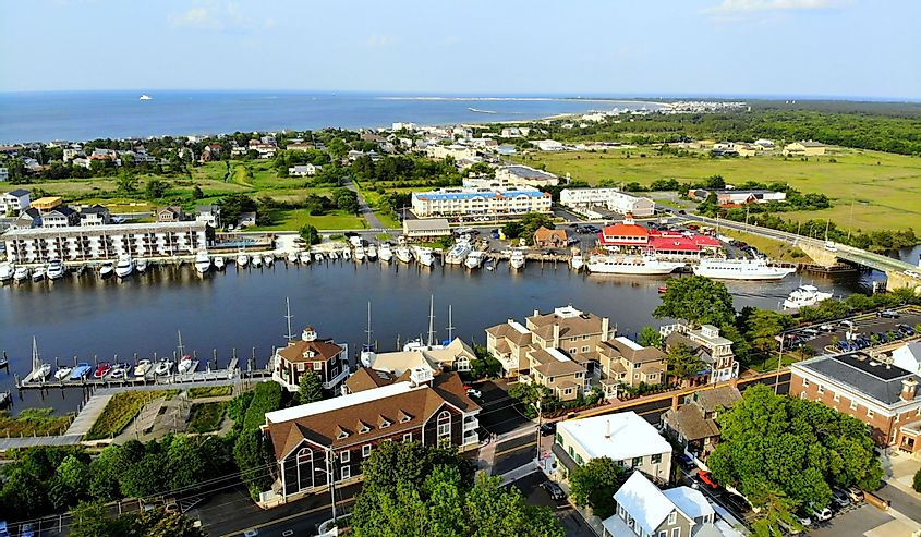 The aerial view of the beach town, fishing port and waterfront residential homes along the canal in Lewes. 