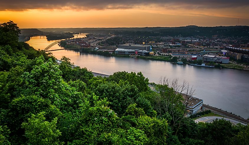 The Ohio River at Pittsburgh at sunset with a steel arch bridge