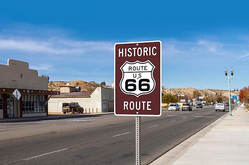 A road sign located across the California Route 66 Museum marks historic Route 66 along D Street in the city of Victorville, California, via Felipe Sanchez / Shutterstock.com