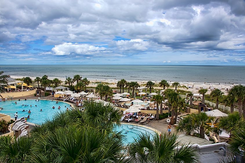 Tourists enjoying a day in the pool at a luxury resort hotel on Fernandina Beach on beautiful Amelia Island.