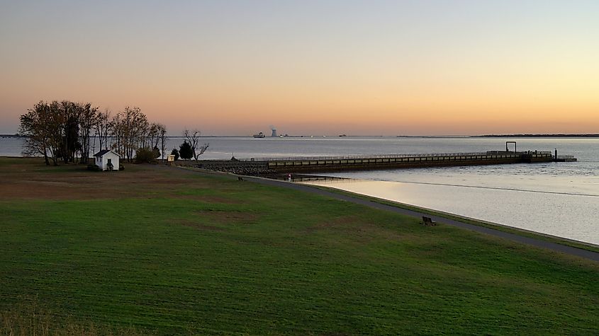 Fort Mott State Park waterfront, sunset view with Delaware River in the background, Pennsville Township, New Jersey.