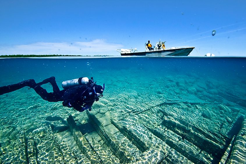 NOAA diver swims over the wreck of the Portland, a wooden schooner that sank in 1877