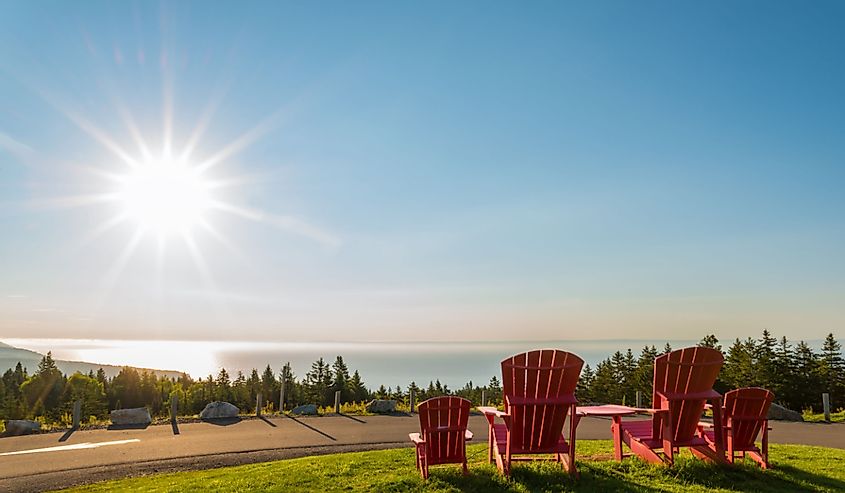 Red chairs from Butland lookoff with a beautiful view of Fundy Shore scenery (Fundy National Park, New Brunswick, Canada)