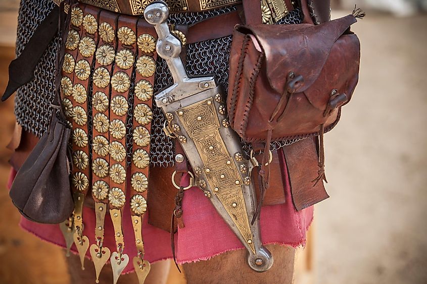 Centurion girding a pugio, a dagger used by roman soldiers as a sidearm. Historical reenactment