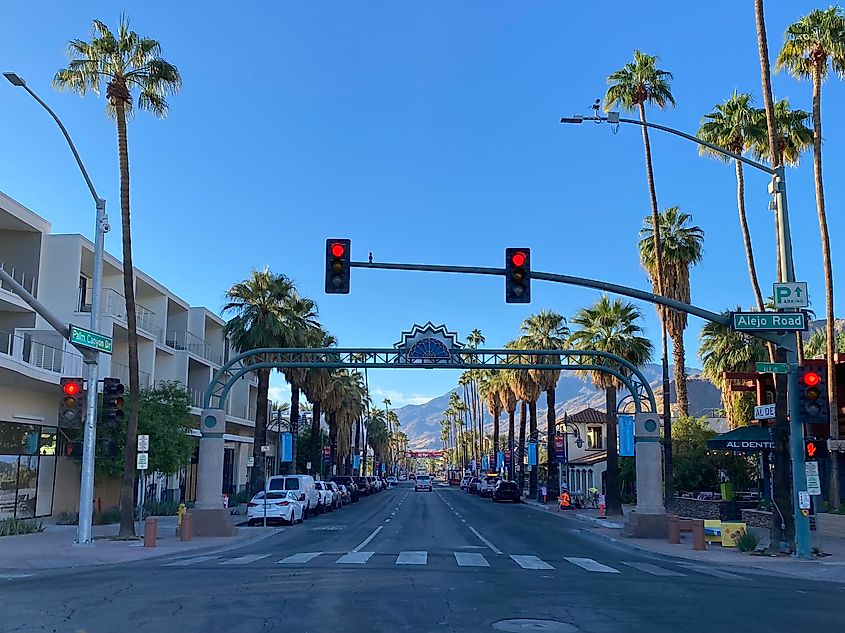 Palm Spring's palm-tree-lined main street before the morning sun descends from the background mountains
