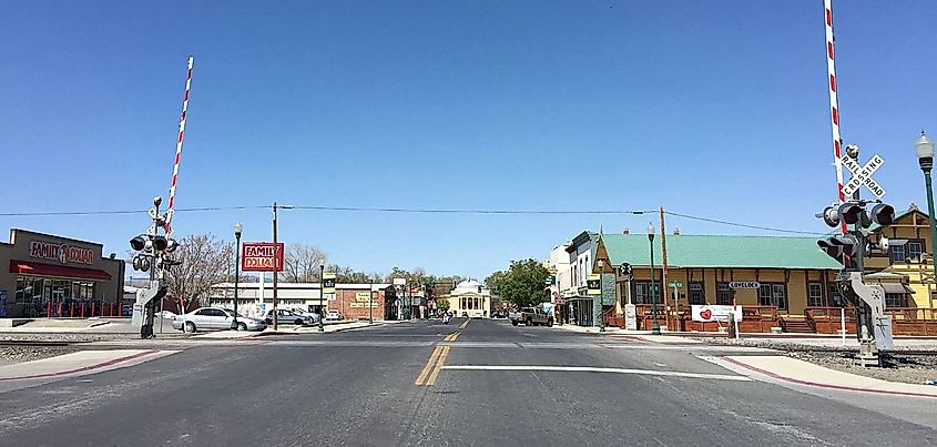 Main Street in Lovelock NV, 18 April 2015, showing the original Southern Pacific depot, early 20th century commercial buildings and the 1920 Pershing County circular courthouse.