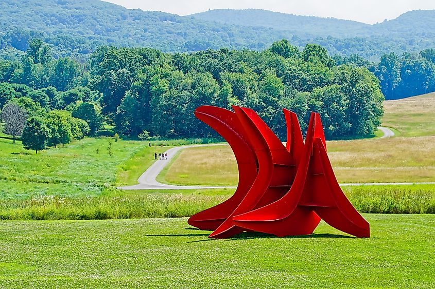 Mountainville, New York/United States-7/7/2019: the sculpture of “five swords” by Alexander Calder overlooking winding path in storm king art center