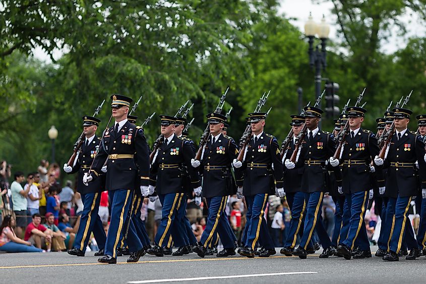 Memorial Day Parade. A marching platoon from the United States Marine Corps wearing blue-white dress uniforms.