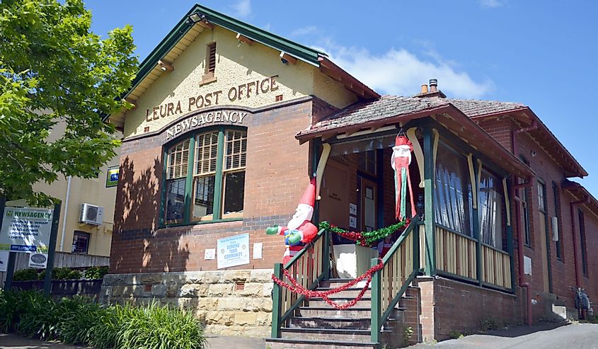 Post office building in Leura, with billboards and New Year decorations.