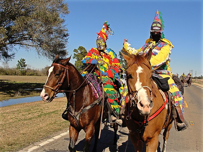 Two Cajun Mardi Gras horseback riders, via Elliott Cowand Jr / Shutterstock.com