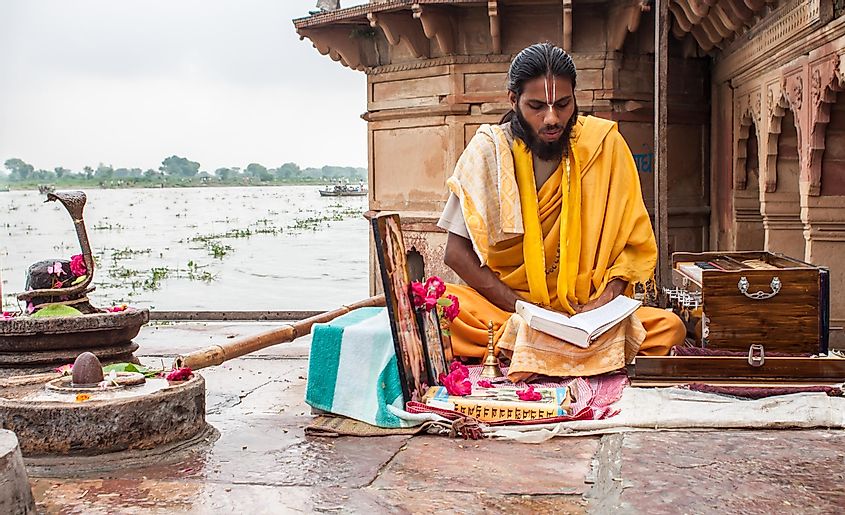 Hindu monk reading scripture
