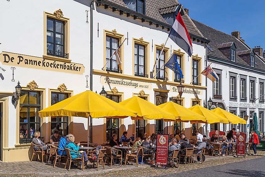 Tourists on the terrace of a pancake restaurant in the center of Thorn in Limburg, Netherlands