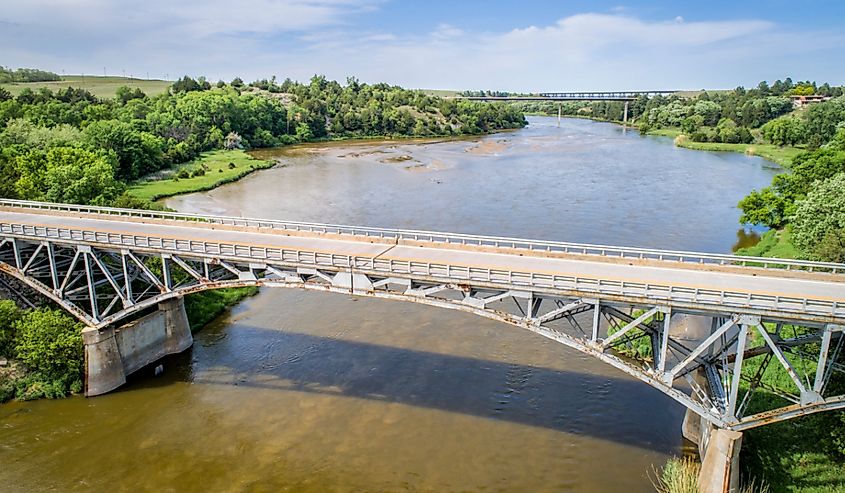 Niobrara River with a historic pin-connected arch Bryan bridge built in 1932 near Valentine in Nebraska Sandhills