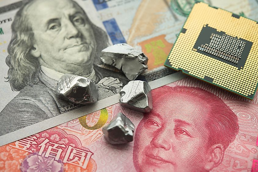 Ge (Germanium) Ga (Gallium) rare earth element on US dollar, Chinese banknote, CPU. US vs China chip war, tech war, semiconductor industry concept, rare germanium and gallium. Via Shutterstock / Pla2na.