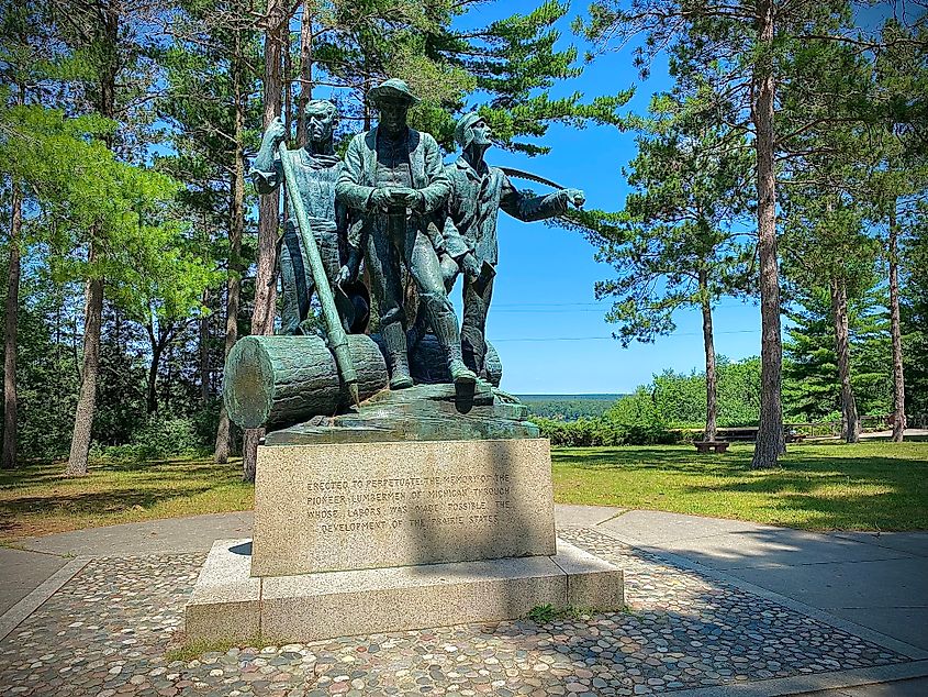 A large bronze statue commemorating Michigan's 19th century lumbermen.