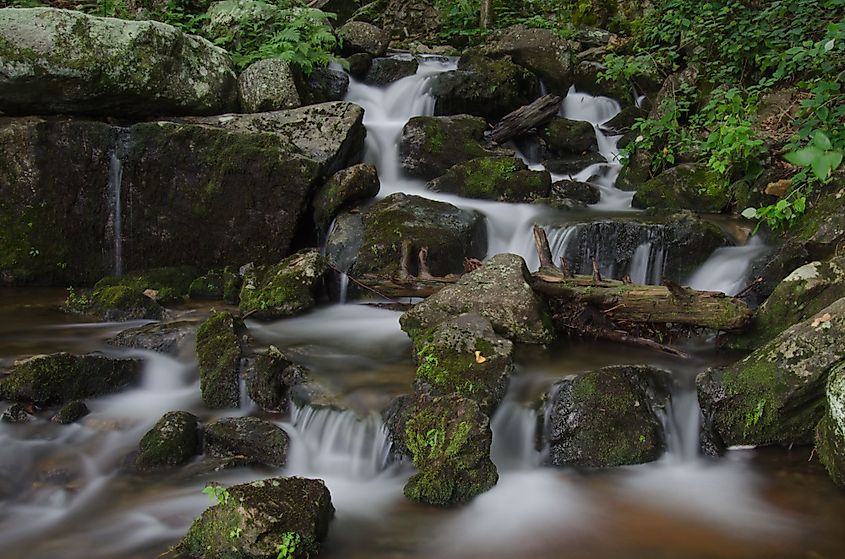 Water cascading over rocks after passing over Crabtree Falls