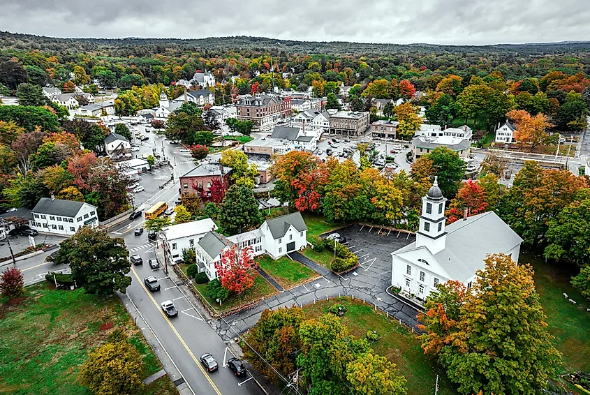 Main Street in Downtown Milford, New Hampshire, with the Oval in the background under trees.