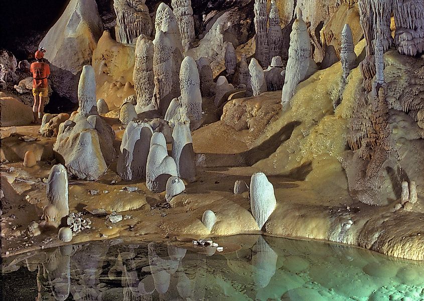 Stalagmites, stalactites, and draperies by a pool in Lechuguilla Cave
