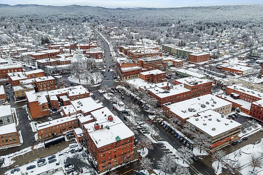 An aerial view of residential buildings and roads covered in the snow in Keene, New Hampshire